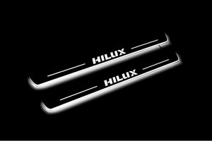 Illuminated LED Door Sill Tread Plates Toyota Hilux VIII 2015+ With Hilux Logo Toyota Led Door Sills opdesign