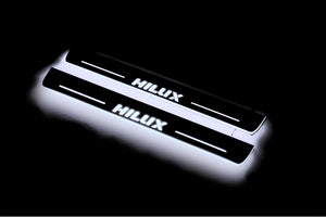 Illuminated LED Door Sill Tread Plates Toyota Hilux VIII 2015+ With Hilux Logo Toyota Led Door Sills opdesign