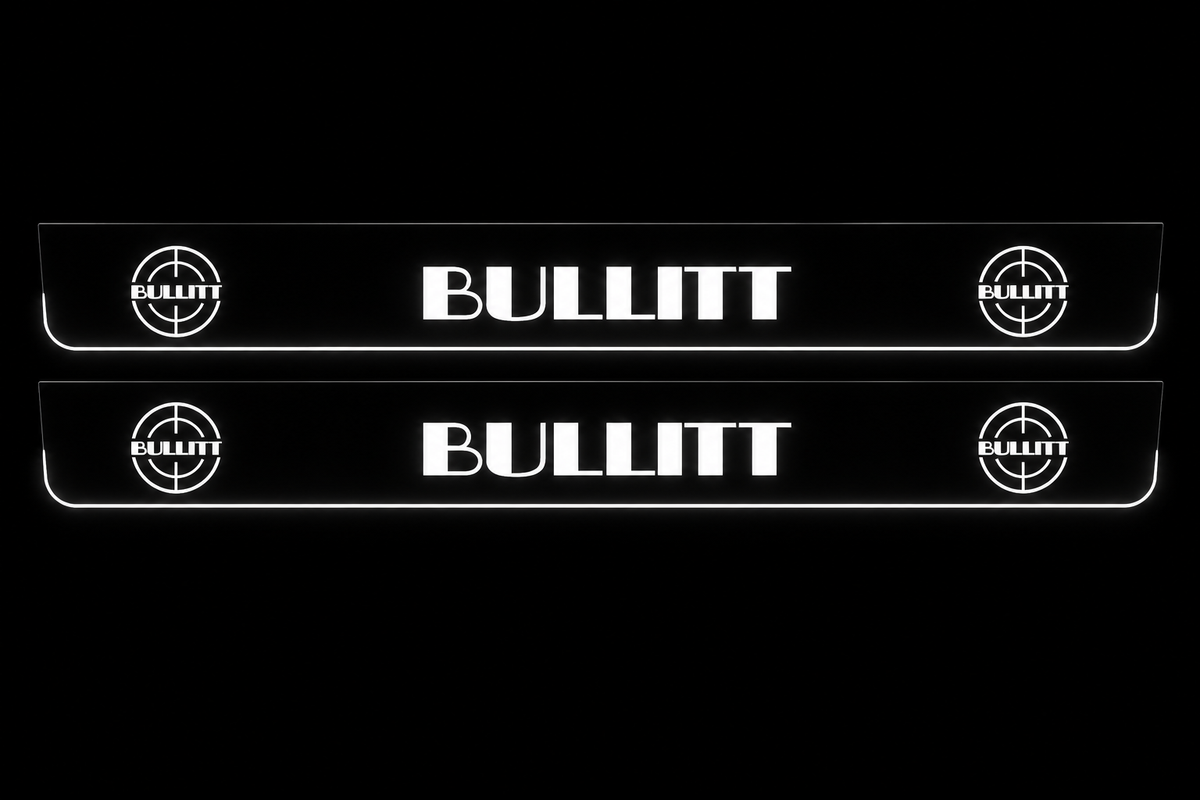Product visualization: two flat bullitt-large-targets Stainless front plates with original source lettering and white LED zones flat brushed stainless steel door sill plates with white LED artwork and edges, dark background.