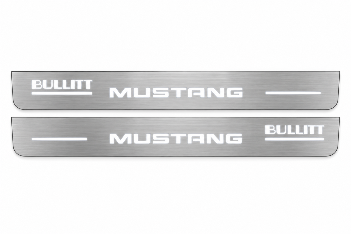 Product visualization: two flat bullitt-mustang-offset Stainless front plates with original source lettering and white LED zones flat brushed stainless steel door sill plates with white LED artwork and edges, white background.