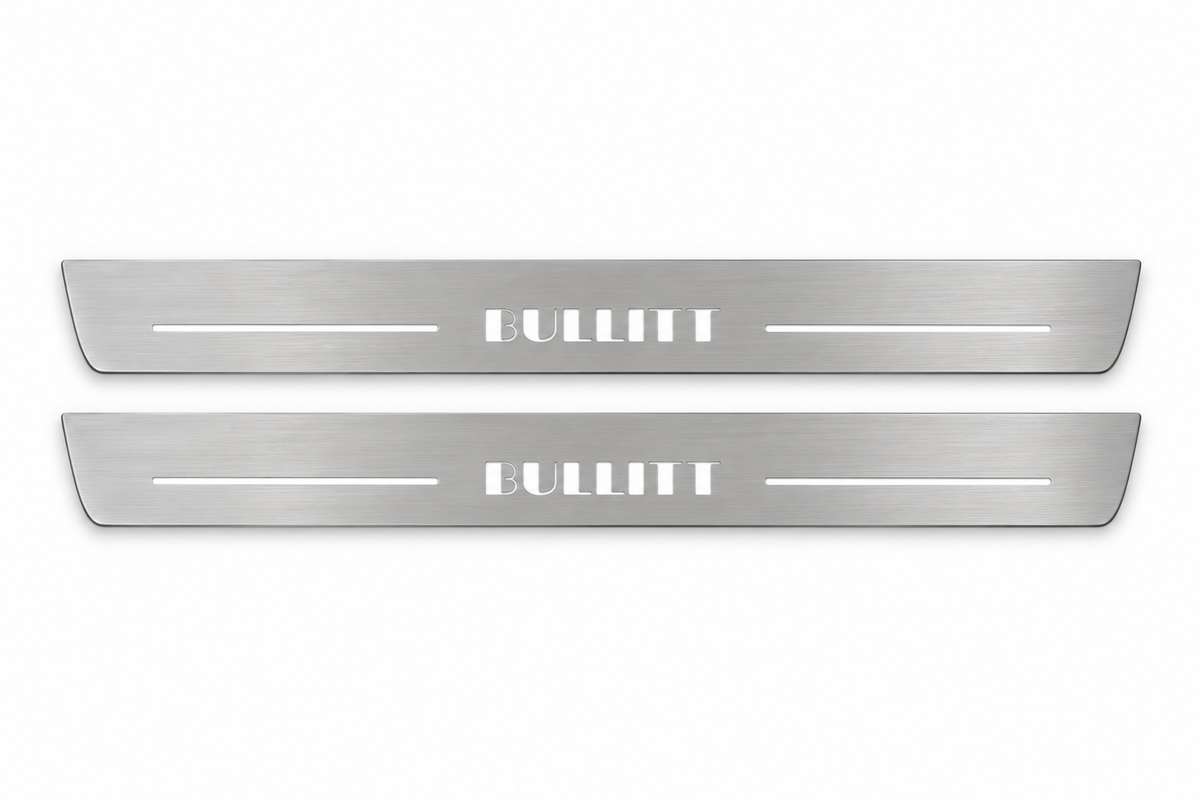 Product visualization: two flat original bullitt-s197-stencil Stainless front plates with exact artwork and white lower/end LEDs flat brushed stainless steel door sill plates with white LED artwork and edges, white background.