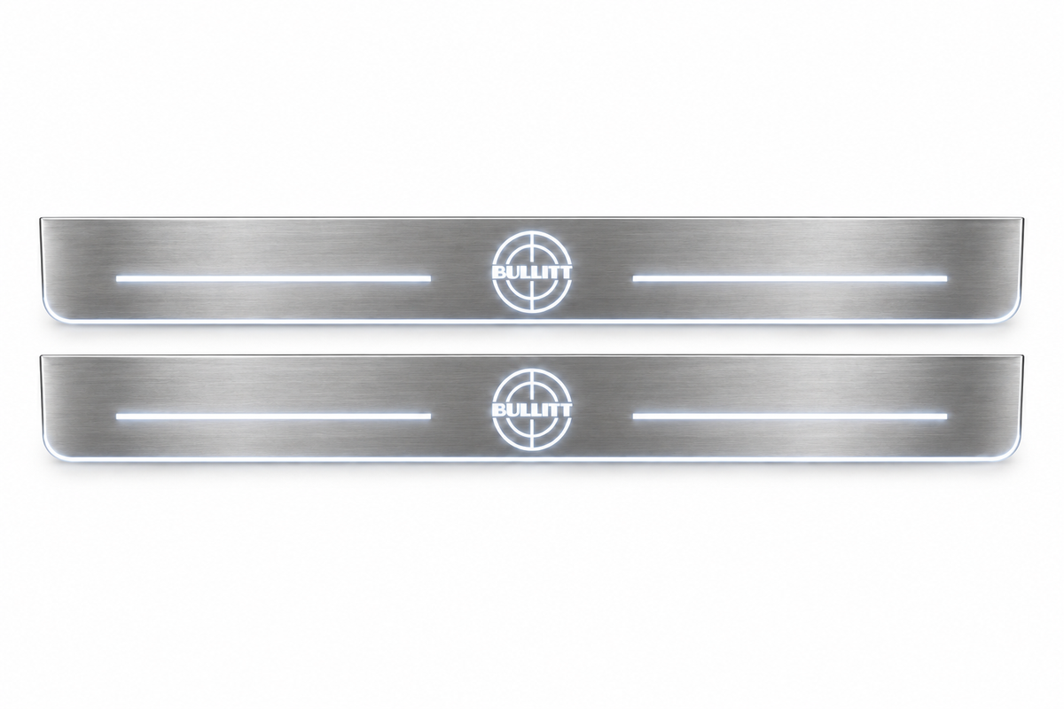 Product visualization: two exact BULLITT target-emblem plates with bars; hidden metal in night main flat brushed stainless steel door sill plates with white LED artwork and edges, white background.