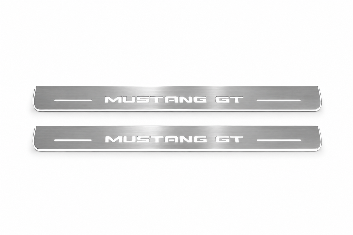 Product visualization: mustang-gt-s197 exact MUSTANG GT source artwork, two flat front plates flat brushed stainless steel door sill plates with white LED artwork and edges, white background.