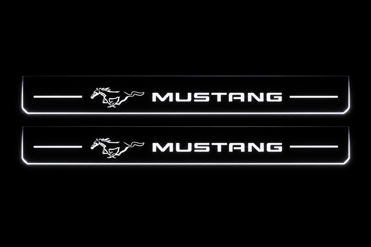 Product visualization: two exact mustang-pony-legacy flat Stainless front sill plates with original artwork, neutral white LEDs and own thin-edge geometry flat brushed stainless steel door sill plates with white LED artwork and edges, dark background.