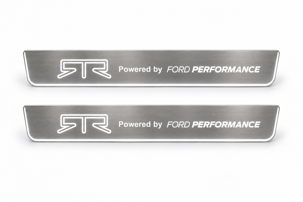 Product visualization: two flat brushed Stainless steel front door sill plates with RTR and Powered by FORD PERFORMANCE artwork on a clean white studio background. Front Pair.