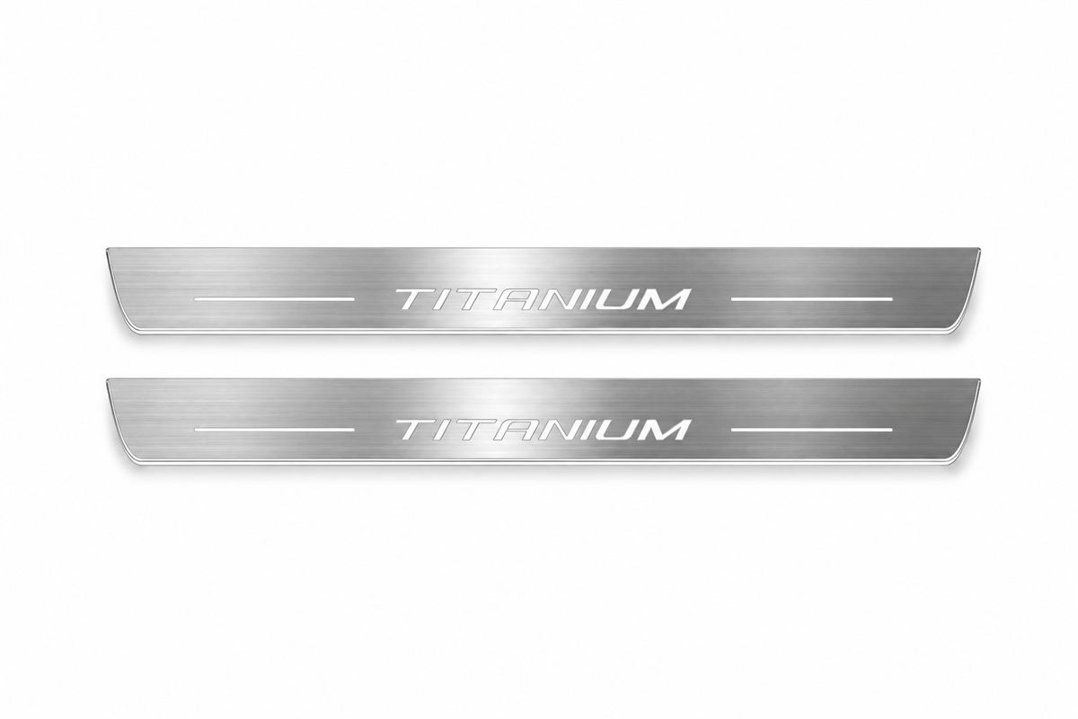 Product visualization: two exact slender Titanium front plates, own original typography and short bars flat brushed stainless steel door sill plates with white LED artwork and edges, white background.