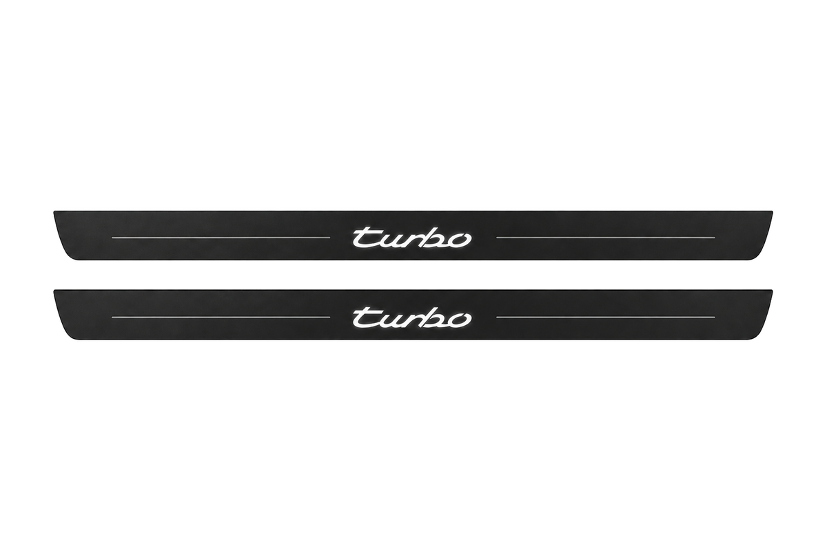 Catalogue illustration of two black Matte PRO front sill plates with illuminated cursive turbo lettering on top. Side edges remain unlit; no rear plates or exact dimensions pictured.