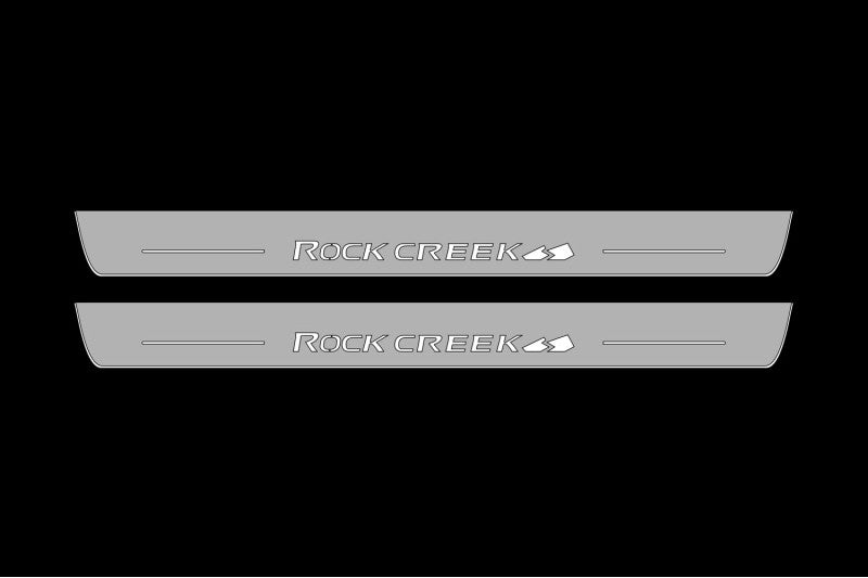 Illuminated LED Door Sills – Tread Plates Nissan Rogue III 2021+ With Rock Creek Logo LED Illuminated Nissan Led Door Sills opdesign
