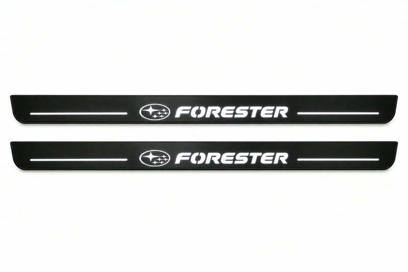 Catalogue illustration of two front black Matte PRO LED door sill plates with illuminated Forester lettering for Subaru Forester SJ; dimensions are selected during manufacture.