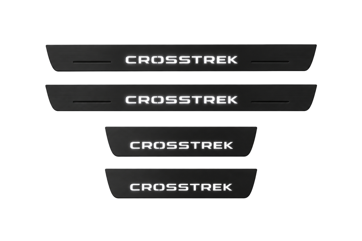 Catalogue illustration of two long black Matte PRO front sill plates and two shorter rear plates with CROSSTREK lettering illuminated on the top. Side edges unlit; vehicle-specific dimensions are not depicted. FRONT option includes front plates only.