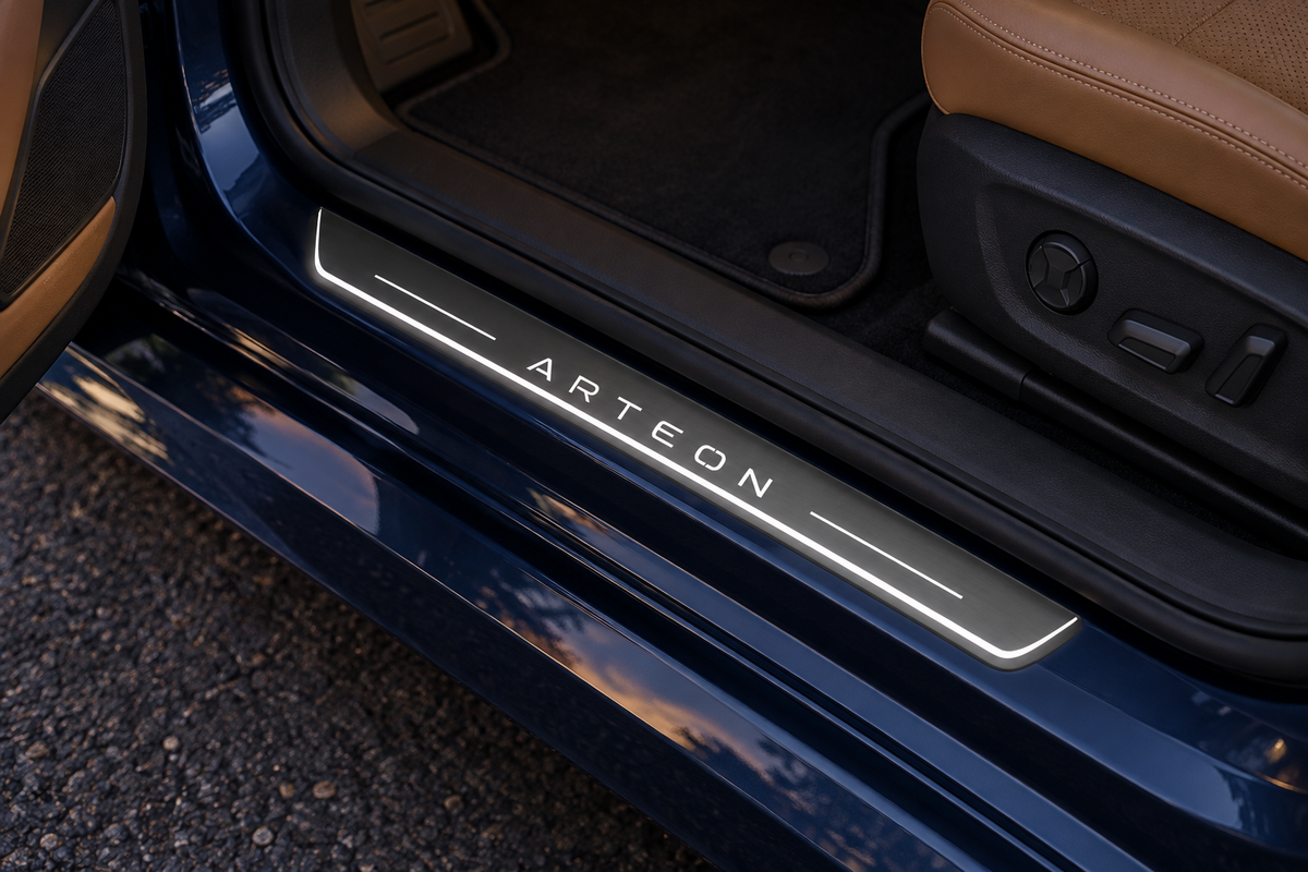 Product visualization of an Arteon Stainless Steel sill on a blue painted-metal threshold, with white Arteon lettering, bars and edge lighting.