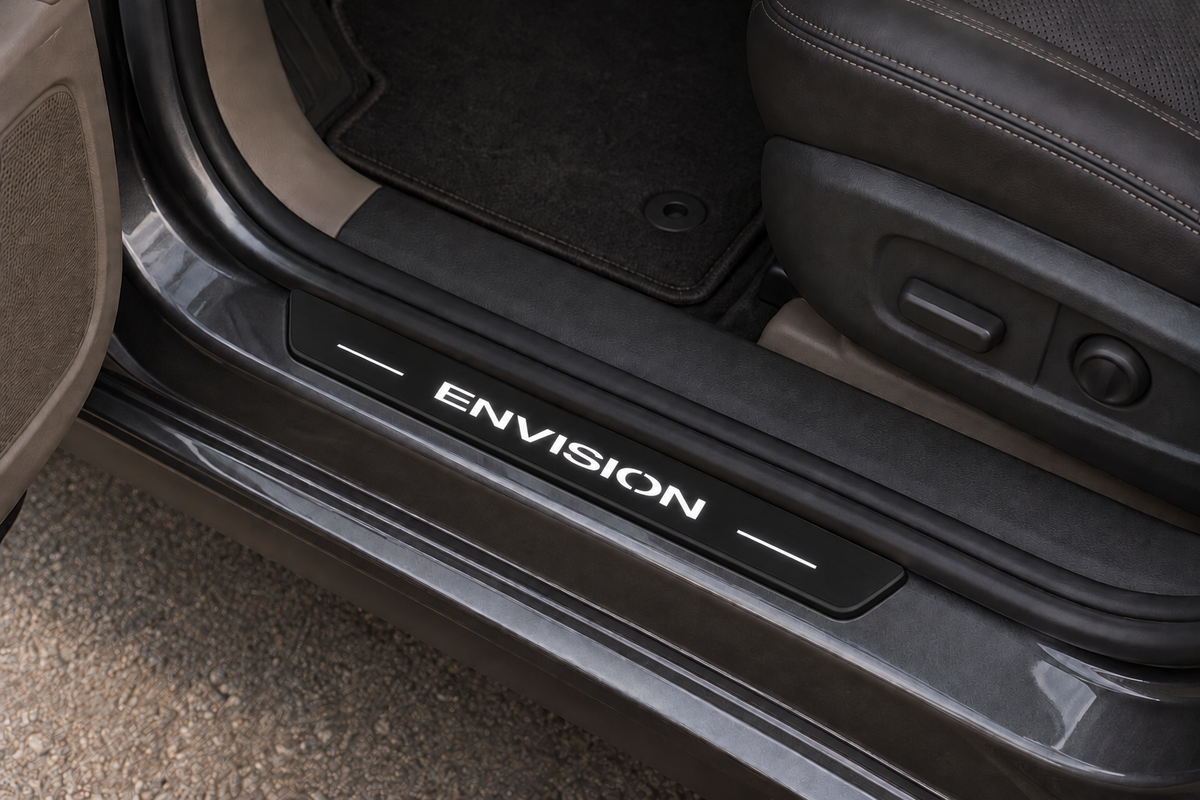 Buick Envision Matte PRO sill visualization on exposed grey metal directly against the rubber seal, white ENVISION artwork and dark perimeter.