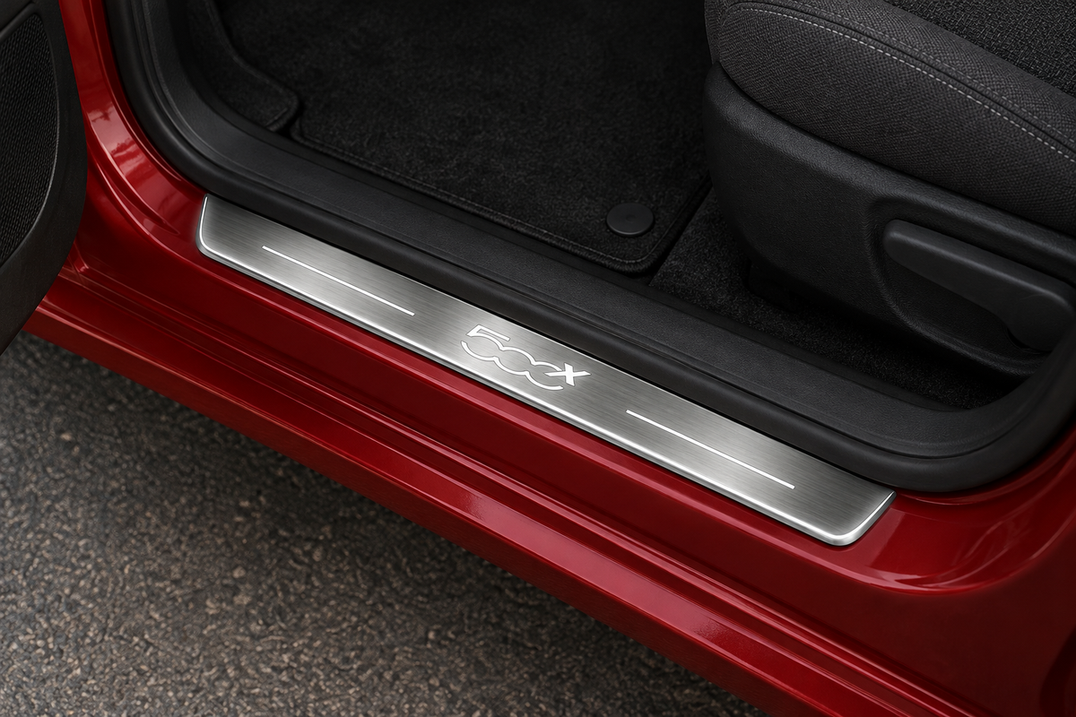 Fiat 500X Stainless Steel product visualization: a grey brushed sill with the source 500X emblem, white top lines and thin edge illumination in a red crossover doorway.