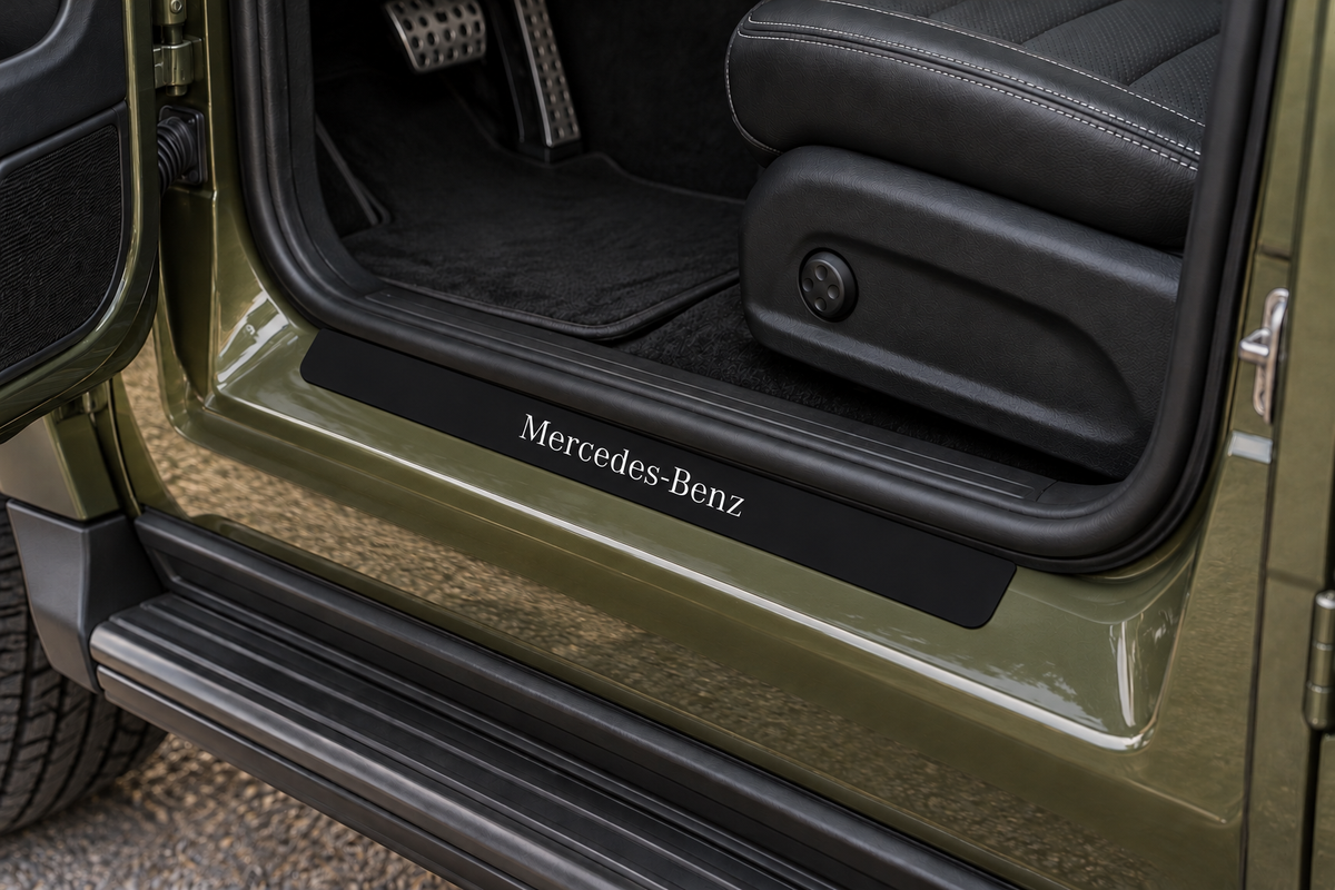 Mercedes-Benz G-Class Matte PRO sill visualization on the horizontal olive-painted metal doorstep directly against the rubber seal; serif lettering and dark edges.