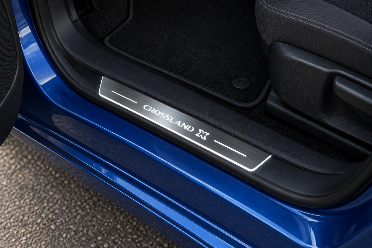 Opel Crossland X Stainless Steel product visualization with CROSSLAND X lettering, white top lines and thin edge illumination in a blue crossover doorway.