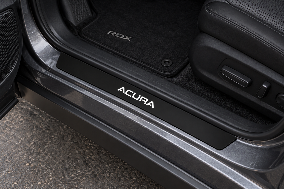 Product visualization of a black Matte PRO sill with white illuminated ACURA lettering in an open RDX doorway; not a customer installation.
