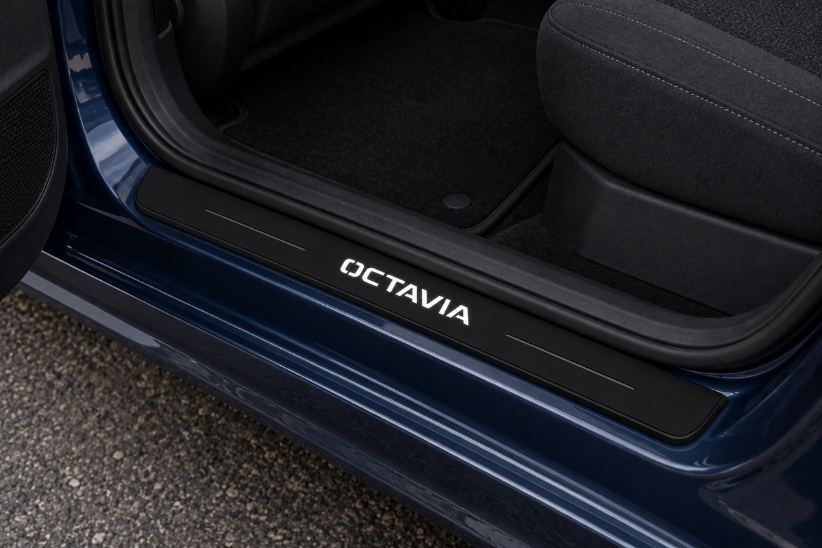 Škoda Octavia Combi NX5 Matte PRO sill visualization in a blue estate doorway, white OCTAVIA lettering with dark decorative lines and unlit black edges.