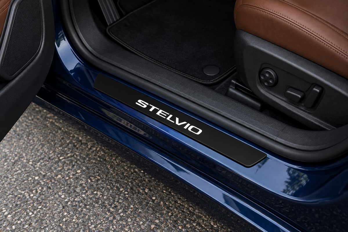 Alfa Romeo Stelvio product visualization with black Matte PRO sill and white Stelvio lettering in a dark-blue doorway; the edge remains unlit.