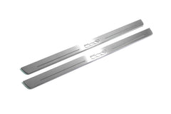 Two long silver-finished door sill plates with 500C lettering on a light background, angled view.