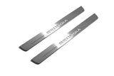 Two long silver-finished door sill plates with Sequoia lettering on a light background, angled view.