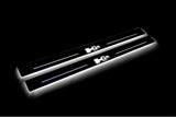 Two long door sill plates with H2 lettering and edges illuminated in white, angled view on a dark background.