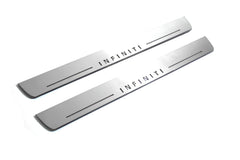 Two long silver-finished door sill plates with Infiniti lettering on a light background, angled view.