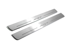 Two long silver-finished door sill plates with SRT lettering on a light background, angled view.