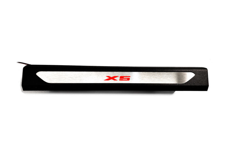 Black molded threshold trim with a silver insert bearing red X5 lettering, straight-on view on a white background.