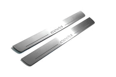 Two long silver-finished door sill plates with Cee’d lettering on a light background, angled view.