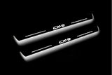Mazda II 2016+ LED door sill plates stainless steel with CX-9 logo