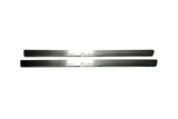 Two long silver-finished door sill plates with Lanos lettering on a light background, straight-on view.