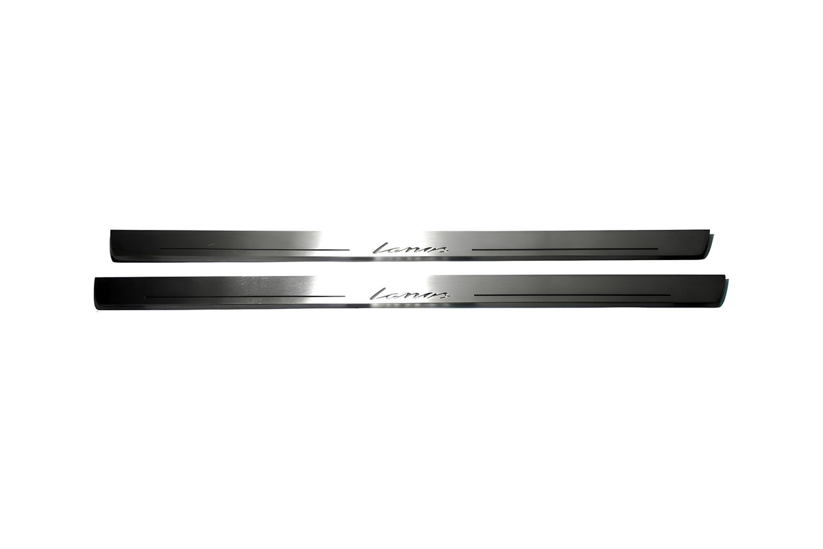 Two long silver-finished door sill plates with Lanos lettering on a light background, straight-on view.