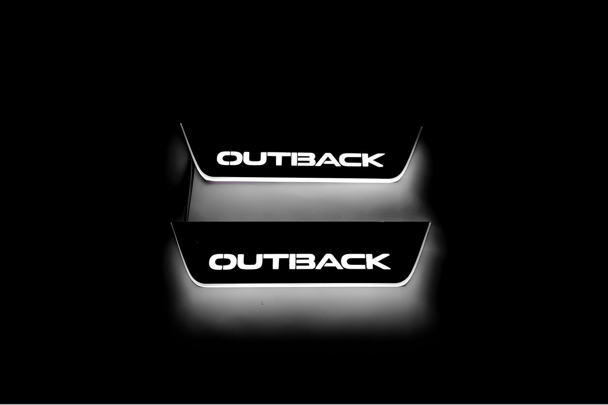Two short door sill plates with Outback lettering and edges illuminated in white, straight-on view on a dark background.
