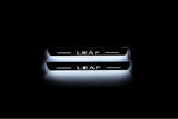 Nissan Leaf I 2010+ stainless steel LED door sill plates with Leaf logo