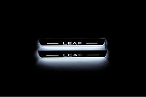 Illuminated LED Door Sill Tread Plates Nissan Leaf II 2017+ With Leaf Logo Nissan Led Door Sills opdesign