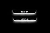 LED door sill plates Mazda II 2016+ in stainless steel with CX-9 logo