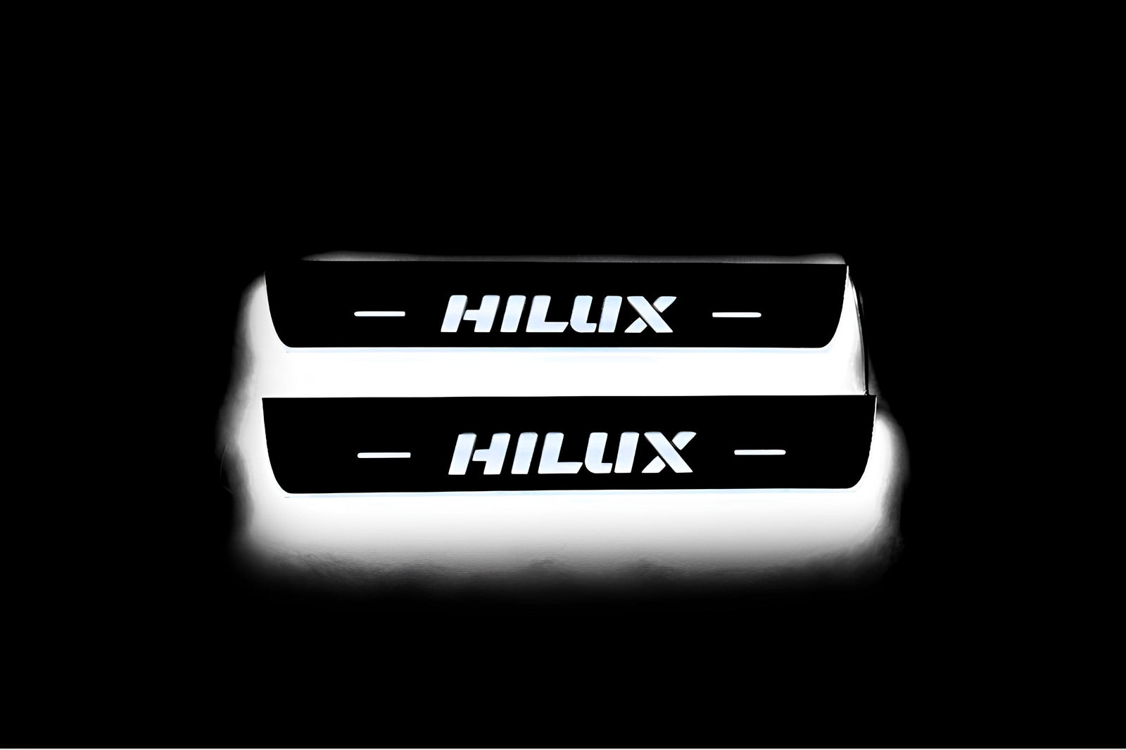 LED door sill plates Toyota Hilux VIII 2015+ stainless steel with Hilux logo