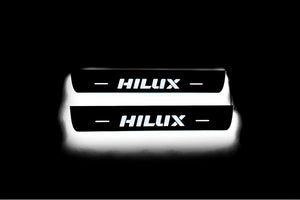 Illuminated LED Door Sill Tread Plates Toyota Hilux VIII 2015+ With Hilux Logo Toyota Led Door Sills opdesign