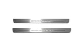 Two short silver-finished door sill plates with Sequoia lettering on a light background, straight-on view.
