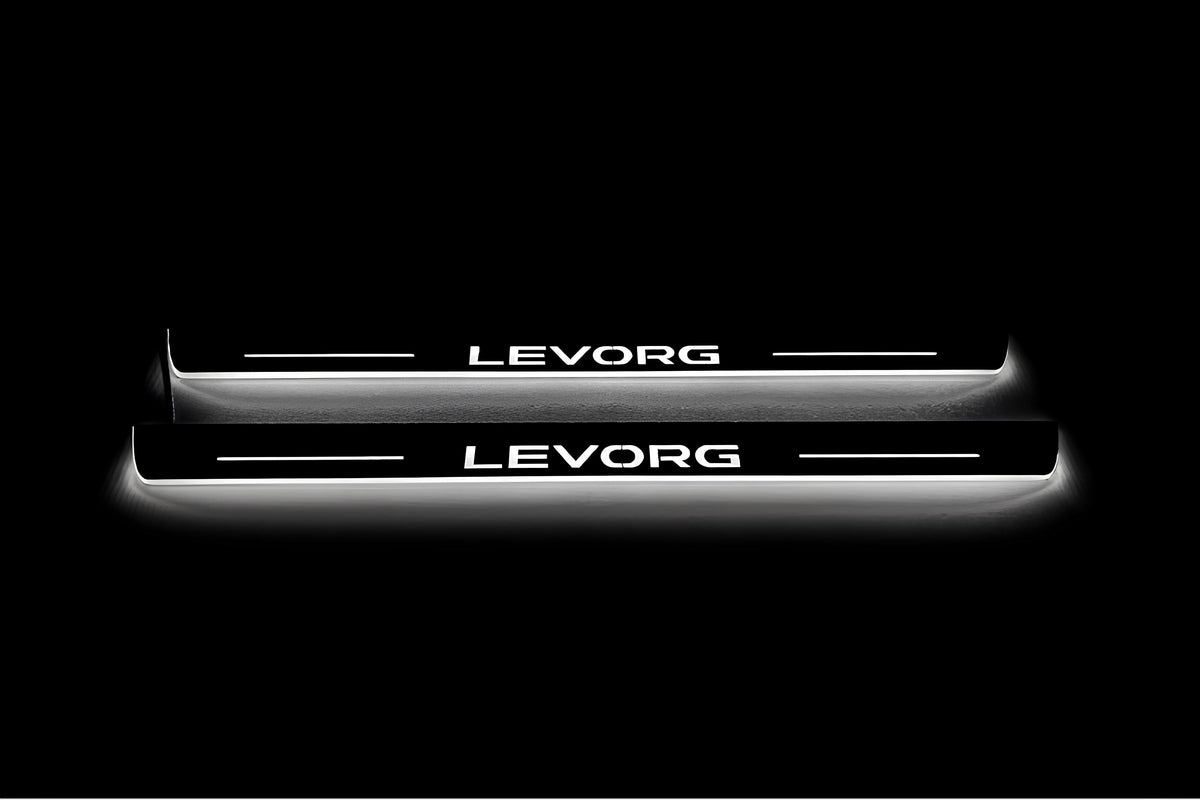 Two long door sill plates with Levorg lettering and edges illuminated in white, straight-on view on a dark background.