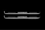 Two long door sill plates with Impreza lettering and edges illuminated in white, straight-on view on a dark background.