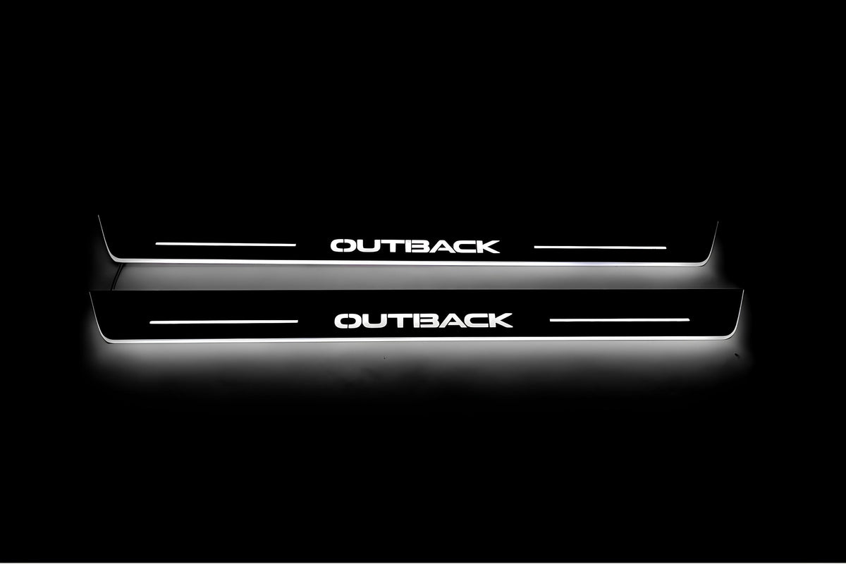 Two long door sill plates with Outback lettering and edges illuminated in white, straight-on view on a dark background.