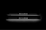 Nissan Patrol Y62 2010+ illuminated entry guards in stainless steel with NISMO logo