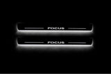 Ford Focus II 2004+ stainless steel illuminated entry guards with Focus logo