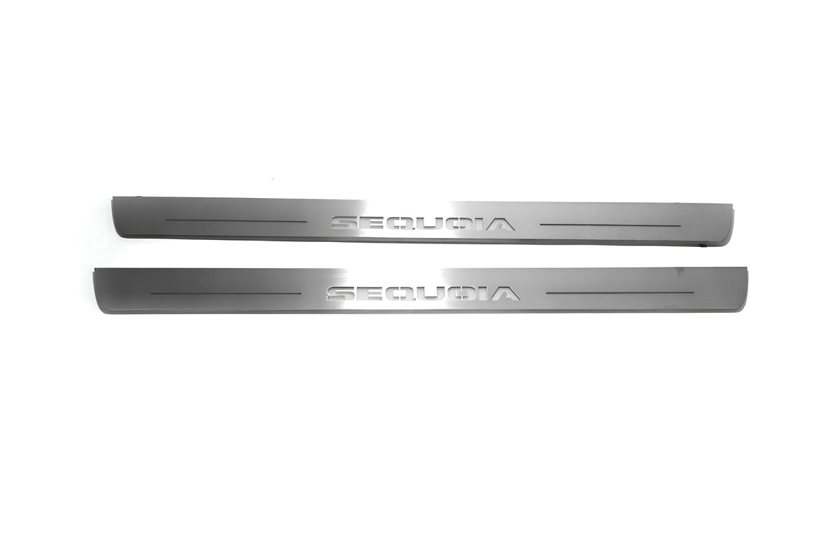 Two long silver-finished door sill plates with Sequoia lettering on a light background, straight-on view.