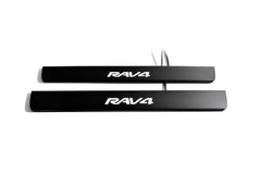 Two black door sill plates with white Rav4 lettering and visible wiring on a light background.