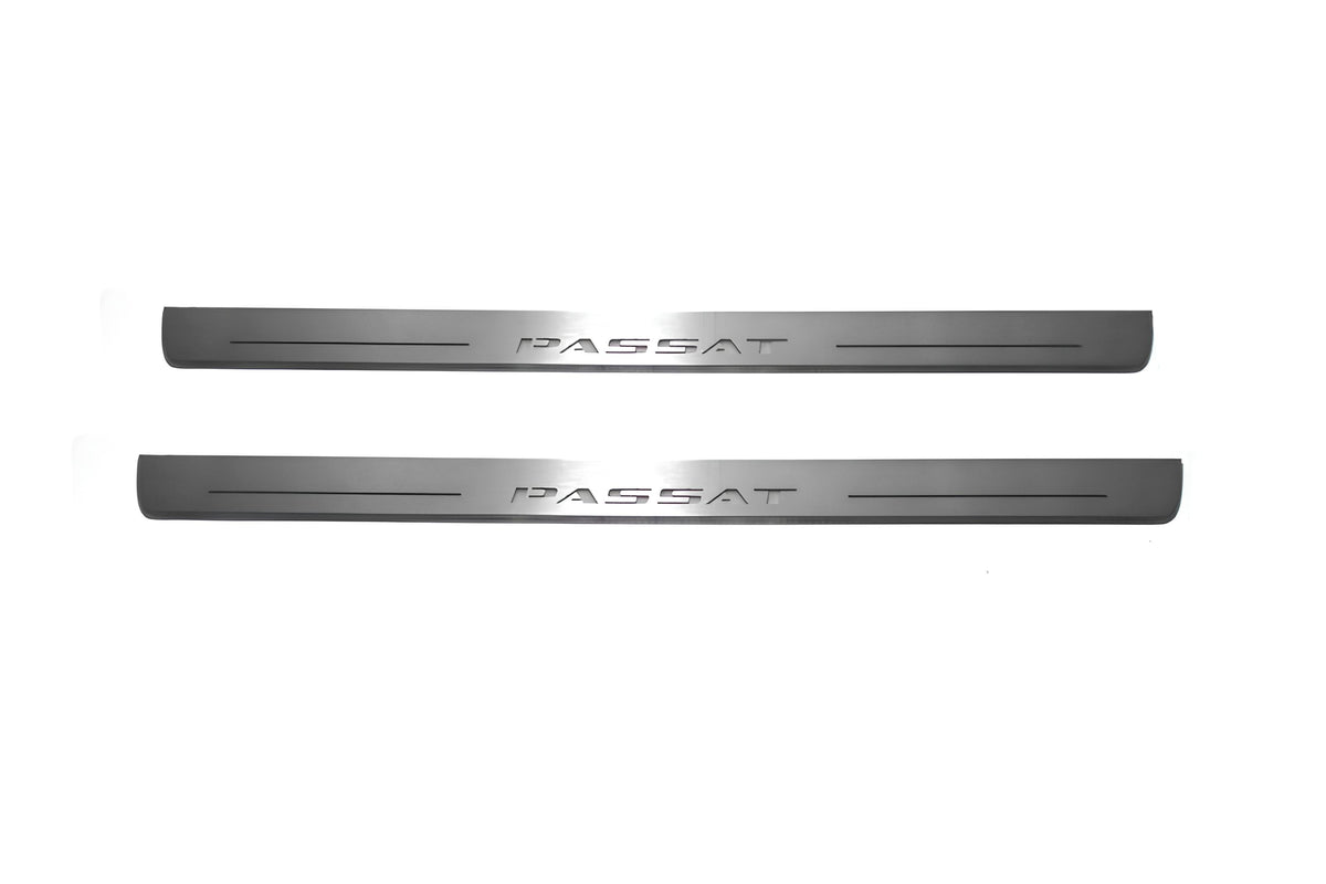 Two long silver-finished door sill plates with Passat lettering on a light background, straight-on view.