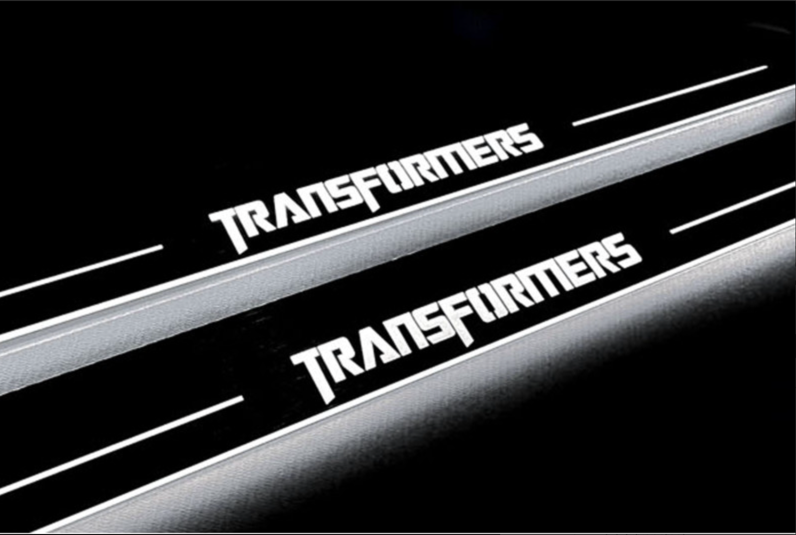 Chevrolet Camaro V E37 2009+ stainless steel LED door sill plates with Transformers logo