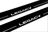 Close-up of Legacy lettering and horizontal lines on black-finished door sill plates.