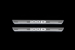 Two silver-faced door sill plates with 100D lettering and edges illuminated white on a black background.